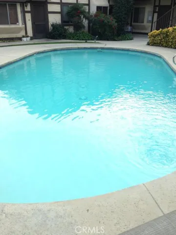 a view of a swimming pool and an outdoor space