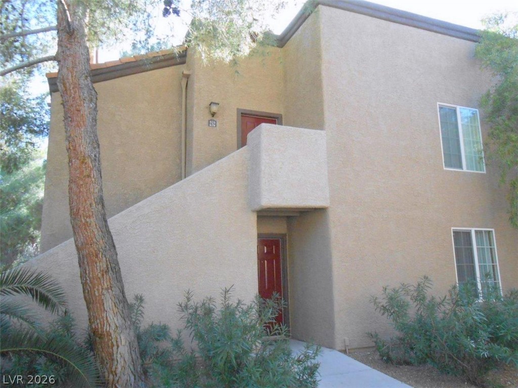 9325 West Desert Inn Road, Unit 132 Las Vegas, NV 89117 - Photo 2 of 36 A well-maintained stucco exterior welcomes you to this multi-level residence with clear windows.