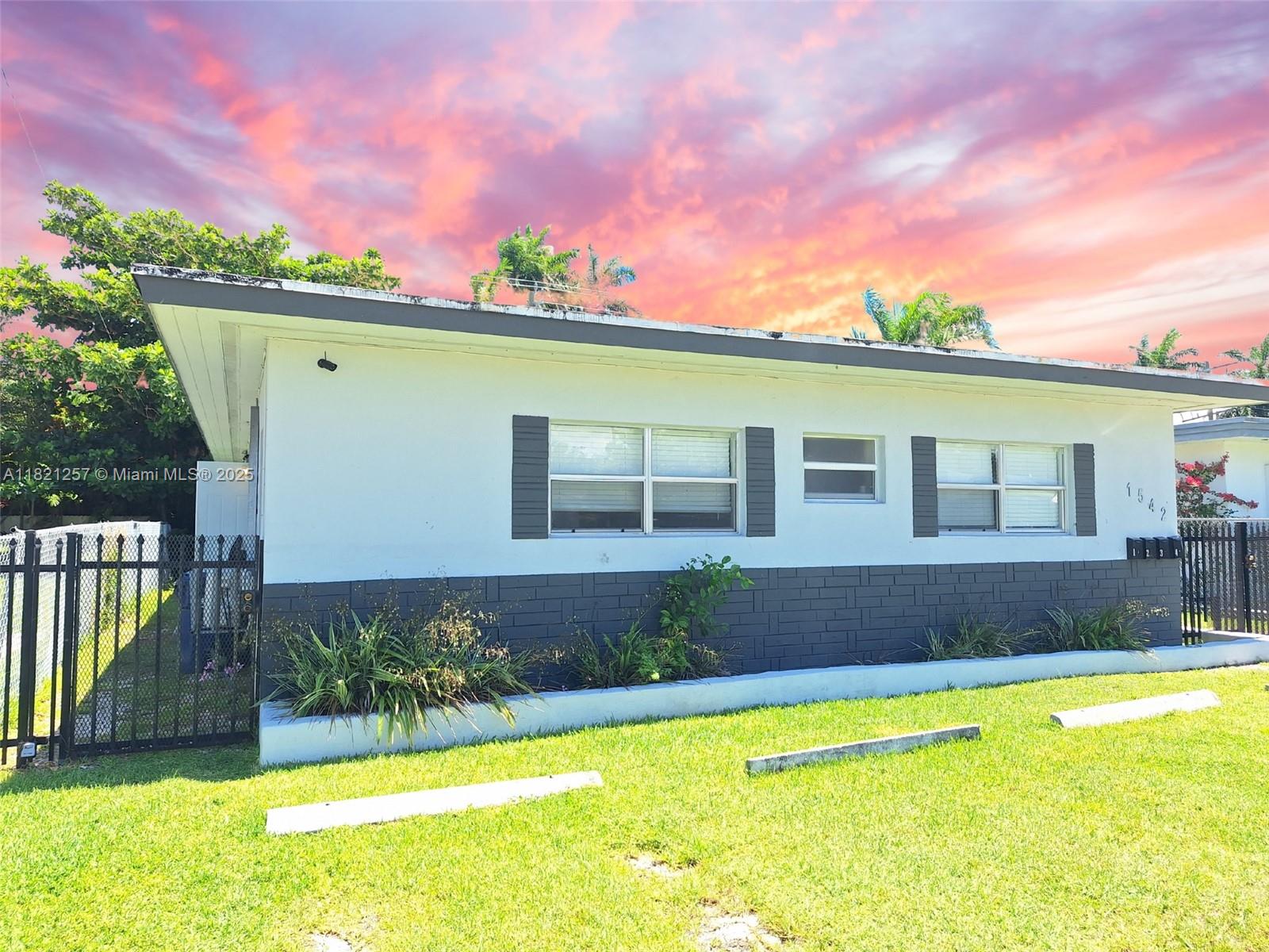 Biscayne Shores Miami, FL 33161 - Photo 1 of 21 a front view of a house with a yard