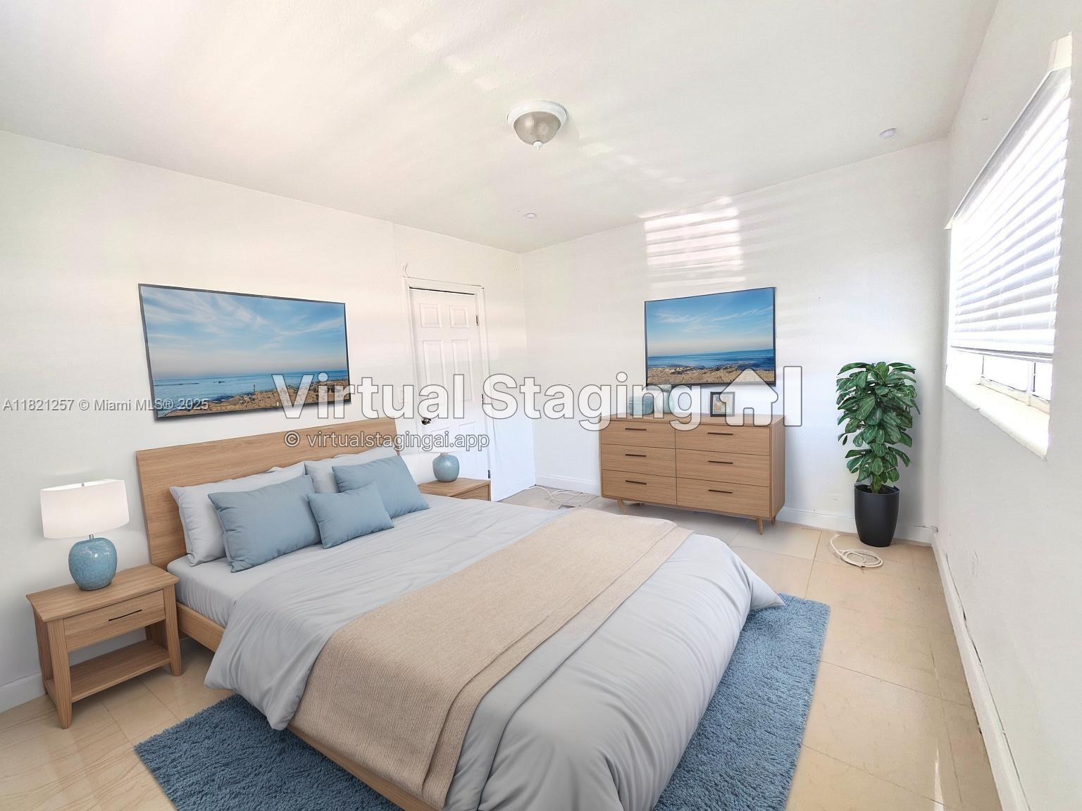 Biscayne Shores Miami, FL 33161 - Photo 4 of 21 a bedroom with a bed and a couch