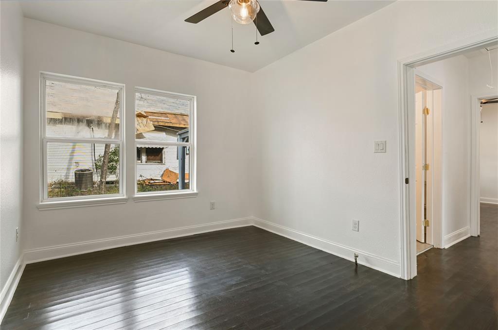 1106 West Chestnut Street Denison, TX 75020 - Photo 4 of 38 Empty room featuring dark hardwood / wood-style flooring and ceiling fan