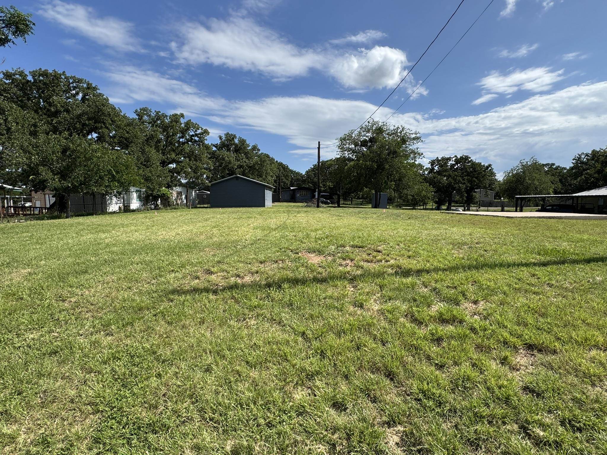 670 Beaver Tow, TX 78672 - Photo 3 of 16 a view of field with tall trees
