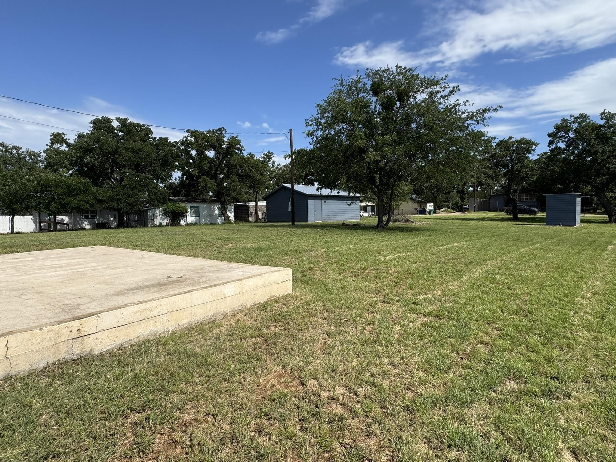 670 Beaver Tow, TX 78672 - Photo 7 of 16 a view of a field of grass and trees