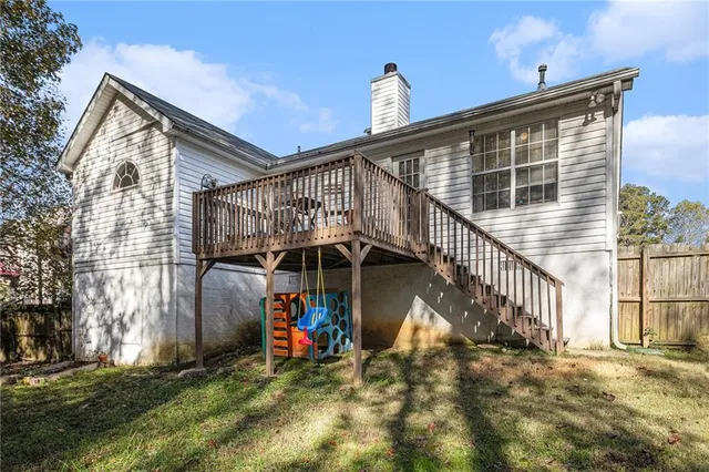 a view of outdoor space with deck and white umbrellas