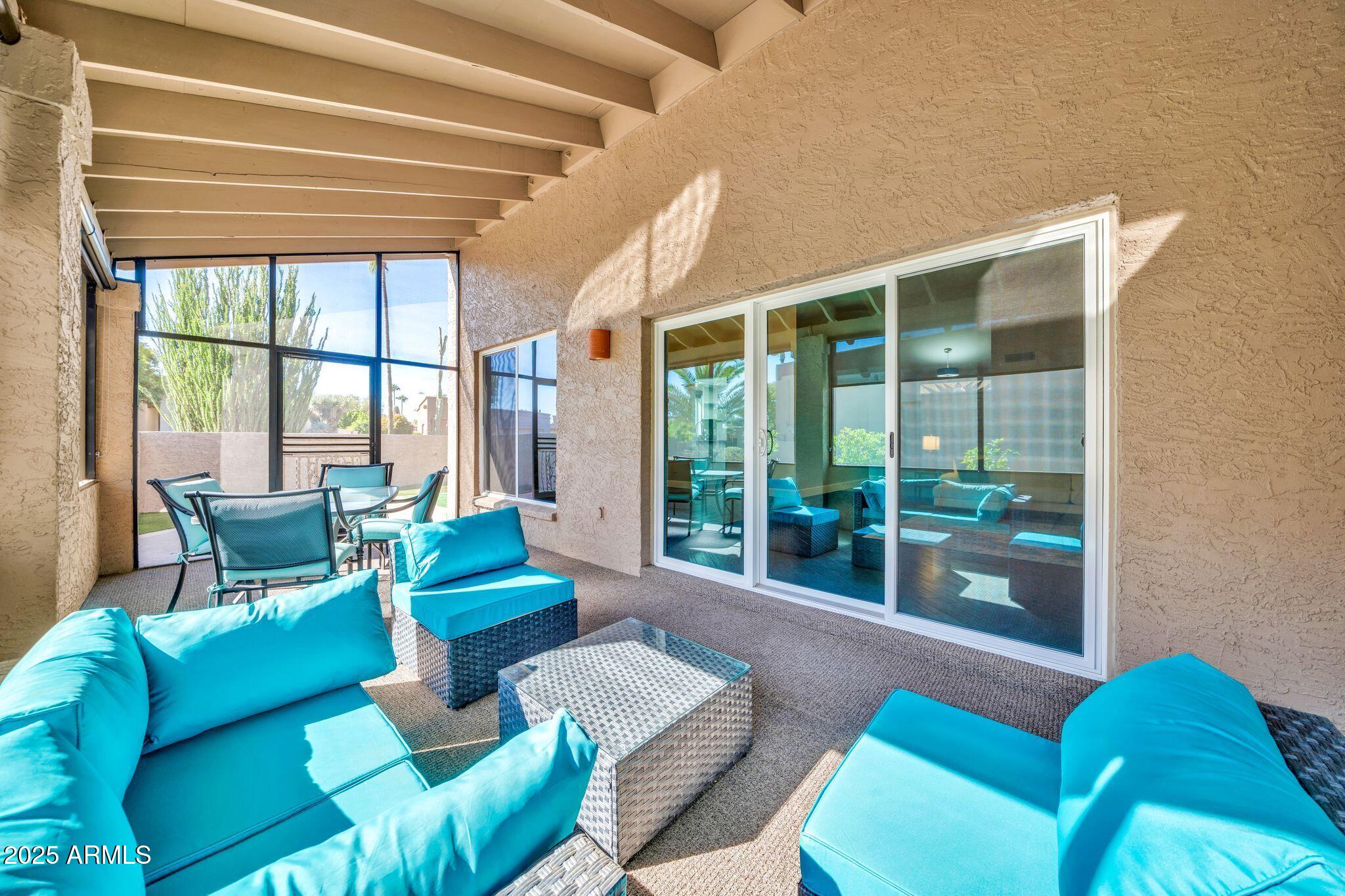 18548 East Parada Circle Rio Verde, AZ 85263 - Photo 16 of 35 a living room with furniture and a large window