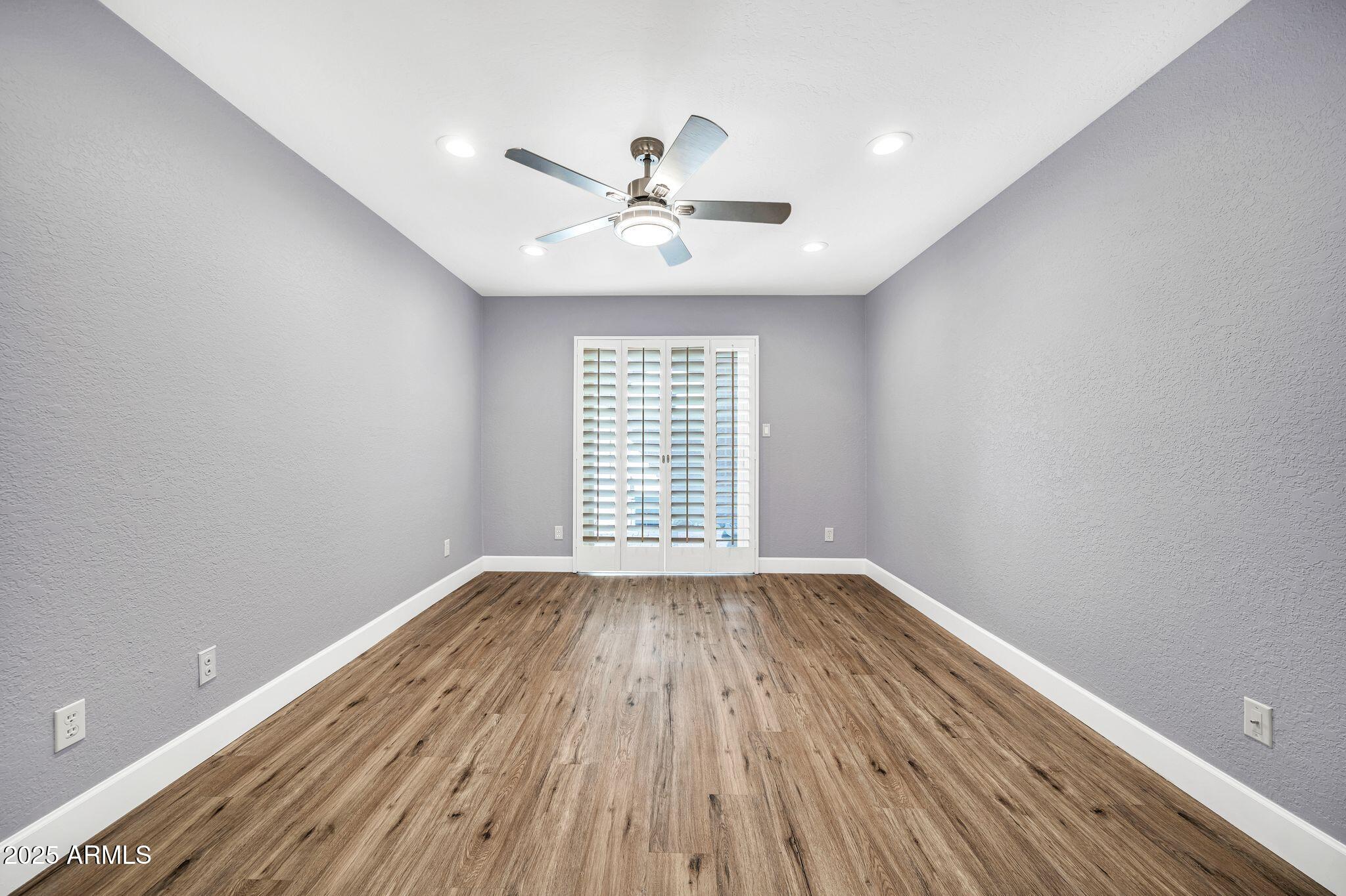 18548 East Parada Circle Rio Verde, AZ 85263 - Photo 18 of 35 wooden floor in an empty room with a window