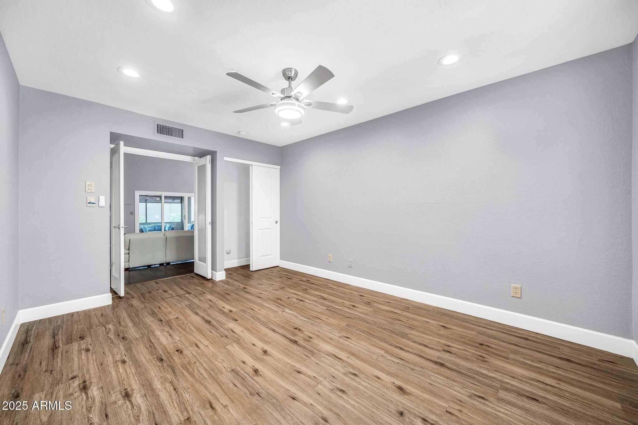 18548 East Parada Circle Rio Verde, AZ 85263 - Photo 19 of 35 a view of an empty room and wooden floor