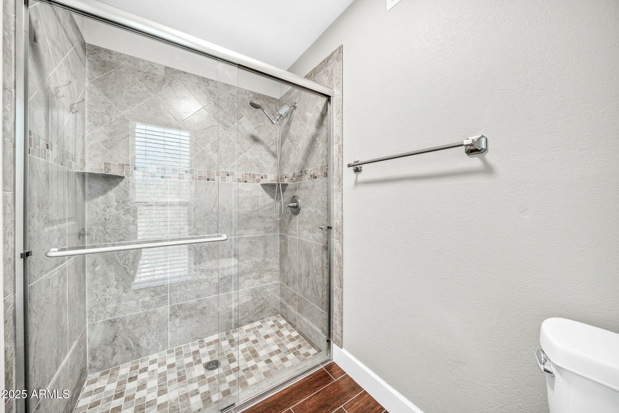 18548 East Parada Circle Rio Verde, AZ 85263 - Photo 25 of 35 a bathroom with a shower and a toilet