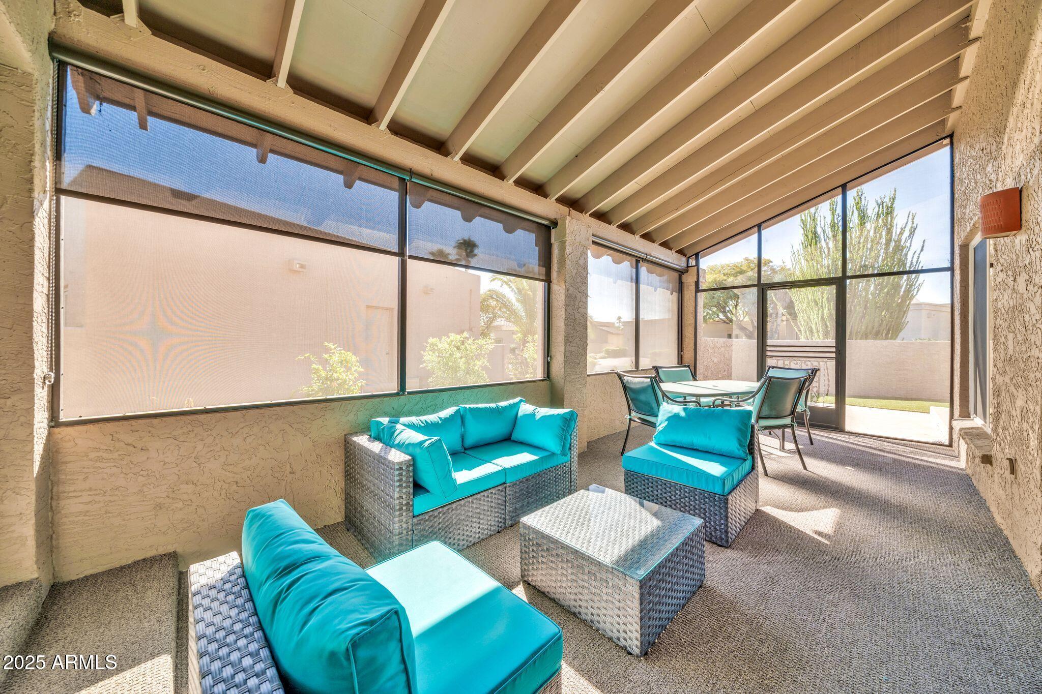 18548 East Parada Circle Rio Verde, AZ 85263 - Photo 6 of 35 a living room with furniture and a large window
