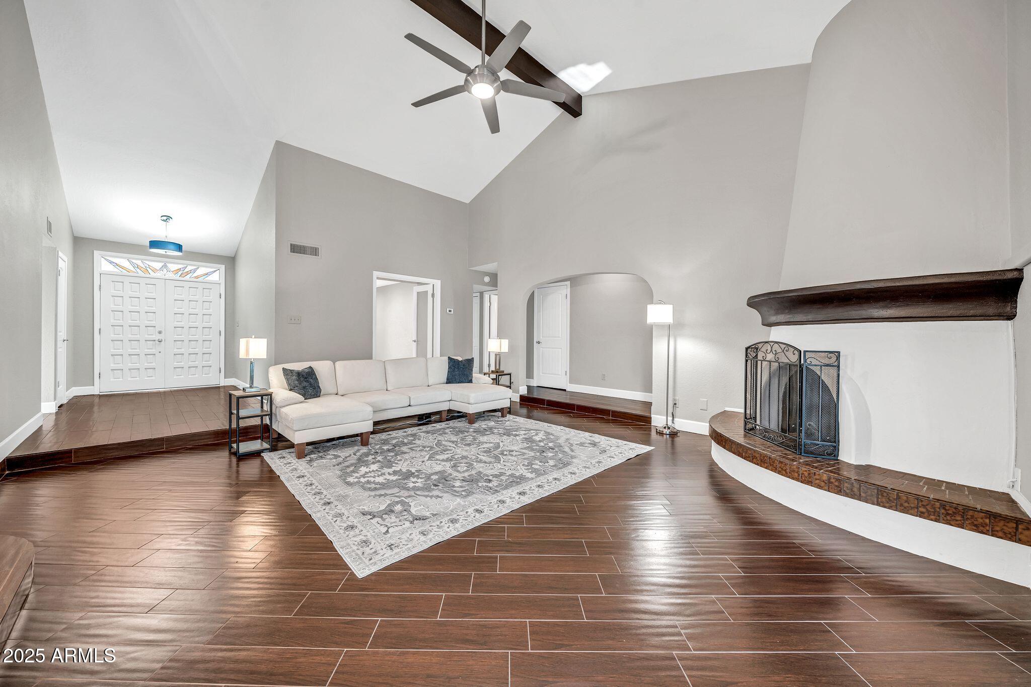 18548 East Parada Circle Rio Verde, AZ 85263 - Photo 8 of 35 a living room with hard wood floors and a rug