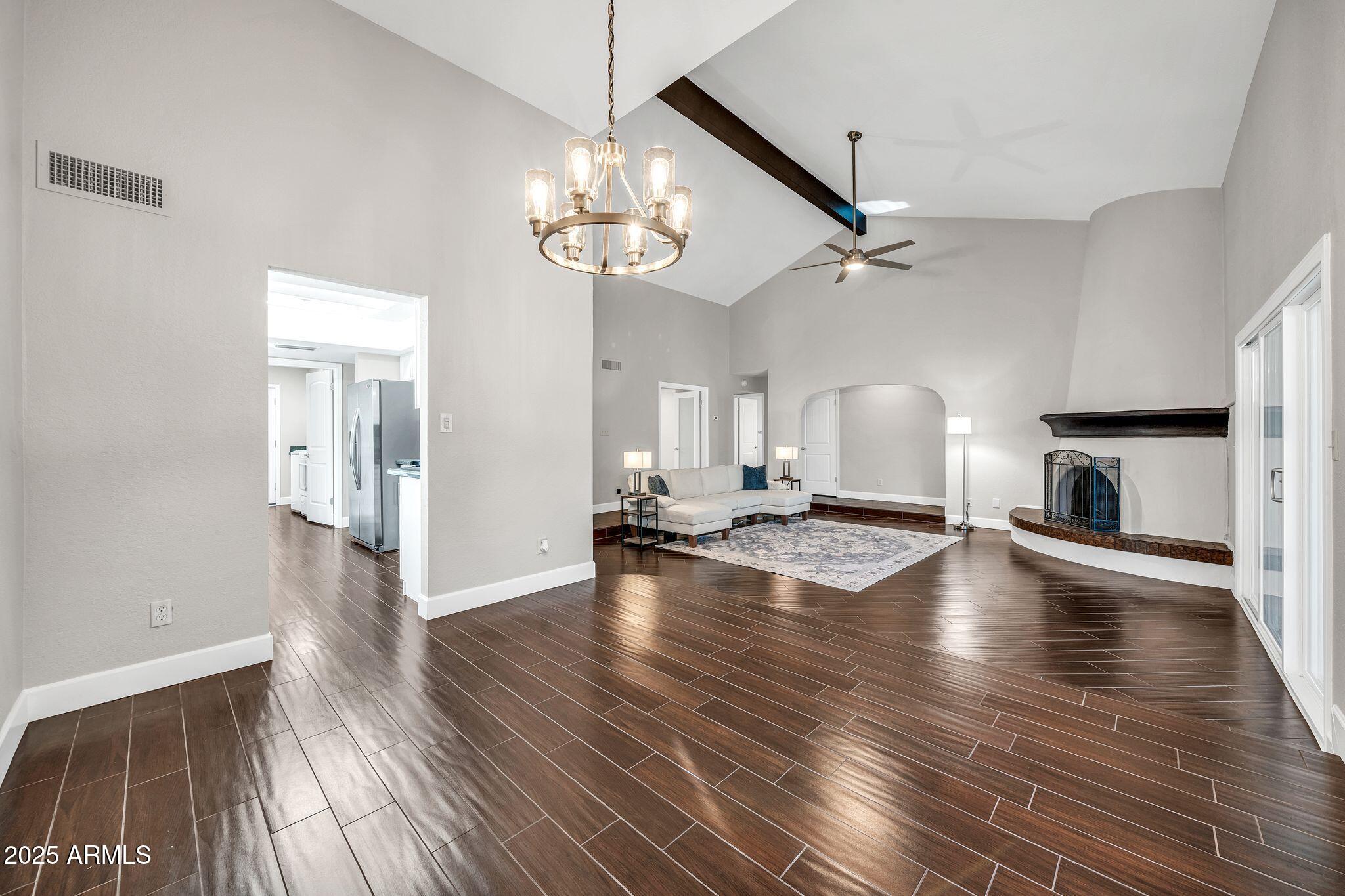 18548 East Parada Circle Rio Verde, AZ 85263 - Photo 9 of 35 a view of a livingroom with wooden floor and staircase