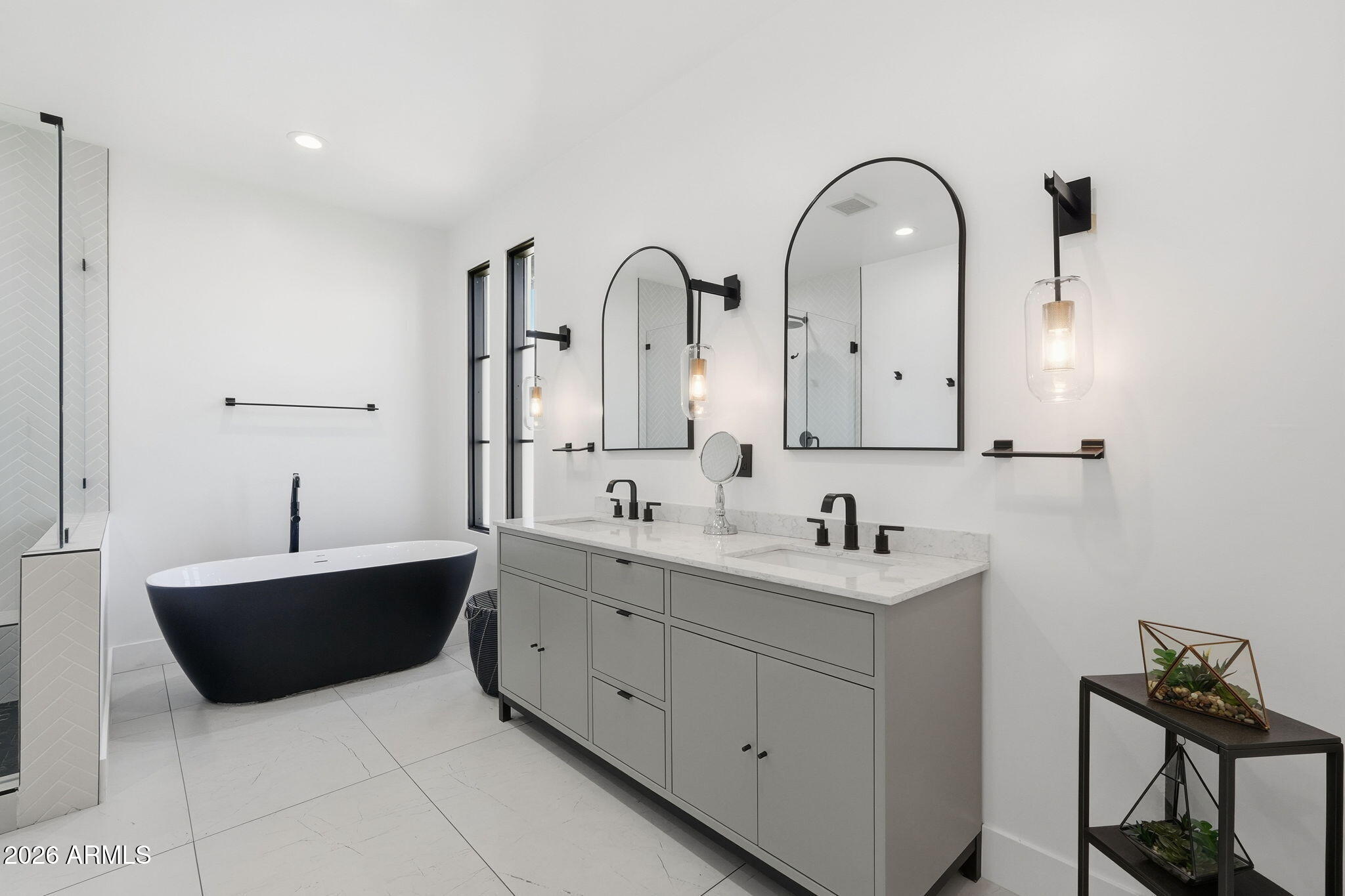 3901 East Weldon Avenue Phoenix, AZ 85018 - Photo 14 of 27 a bathroom with a double vanity sink and mirror
