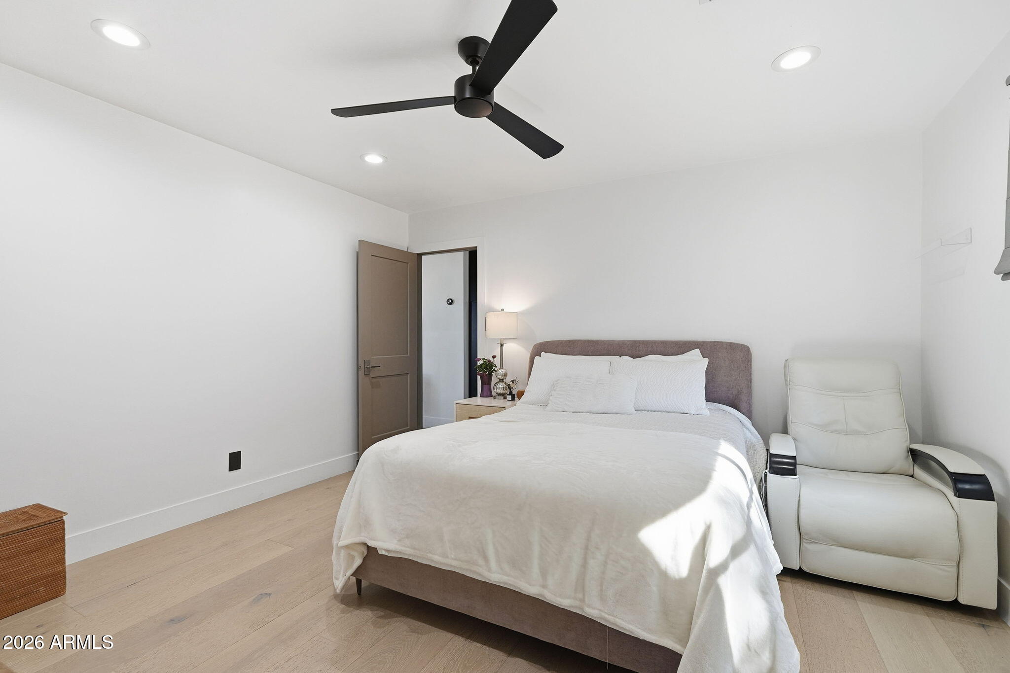 3901 East Weldon Avenue Phoenix, AZ 85018 - Photo 15 of 27 a bedroom with a bed and a couch