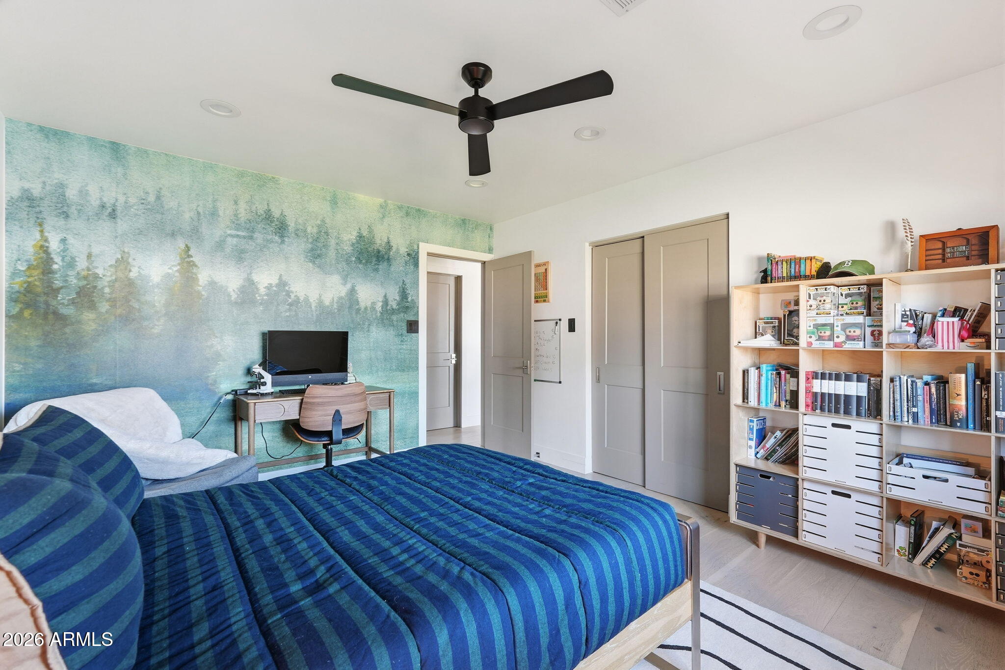 3901 East Weldon Avenue Phoenix, AZ 85018 - Photo 16 of 27 a bedroom with a bed and a flat screen tv