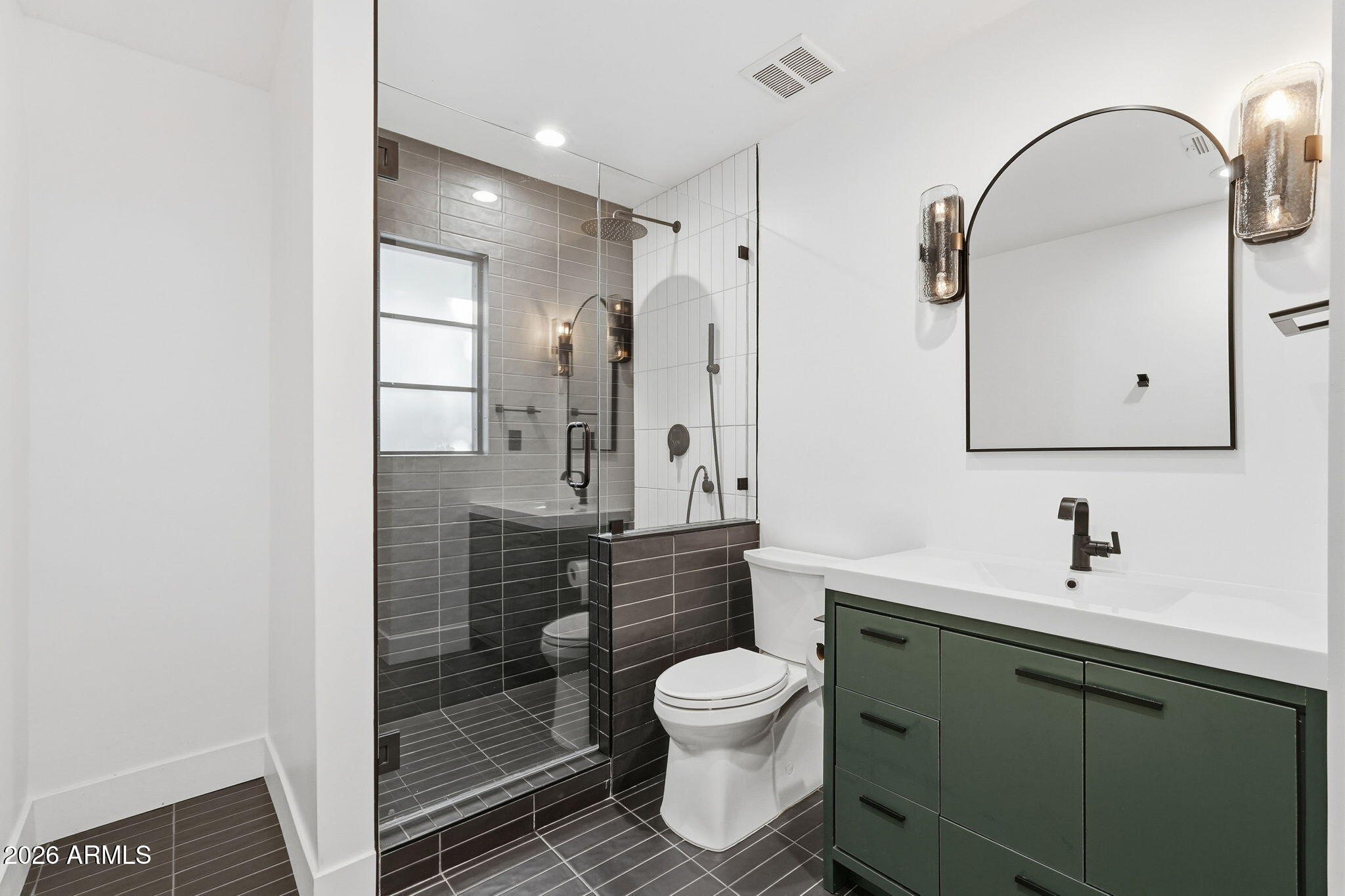 3901 East Weldon Avenue Phoenix, AZ 85018 - Photo 18 of 27 a bathroom with a toilet sink and mirror