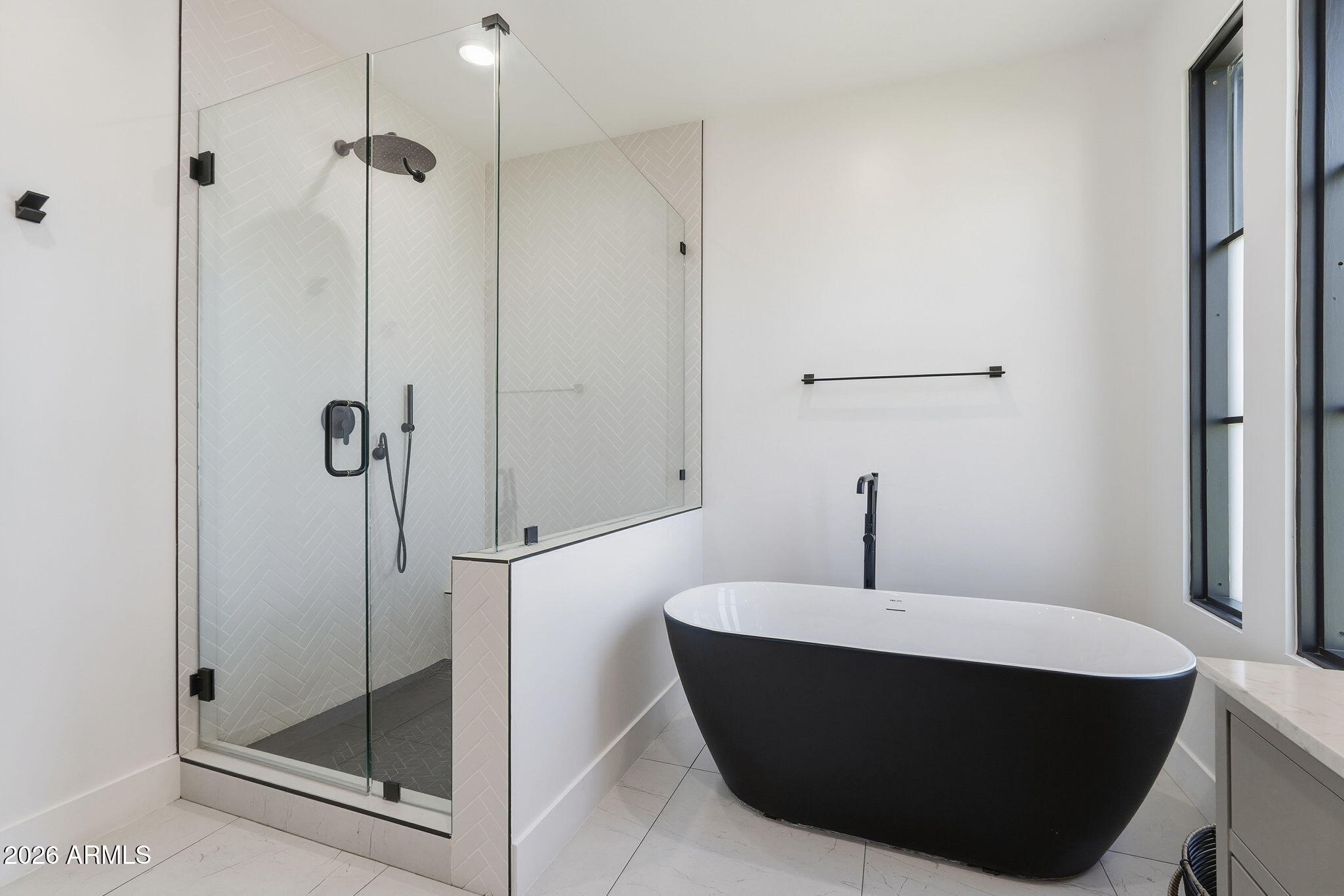 3901 East Weldon Avenue Phoenix, AZ 85018 - Photo 19 of 43 a bathroom with a bathtub and a shower