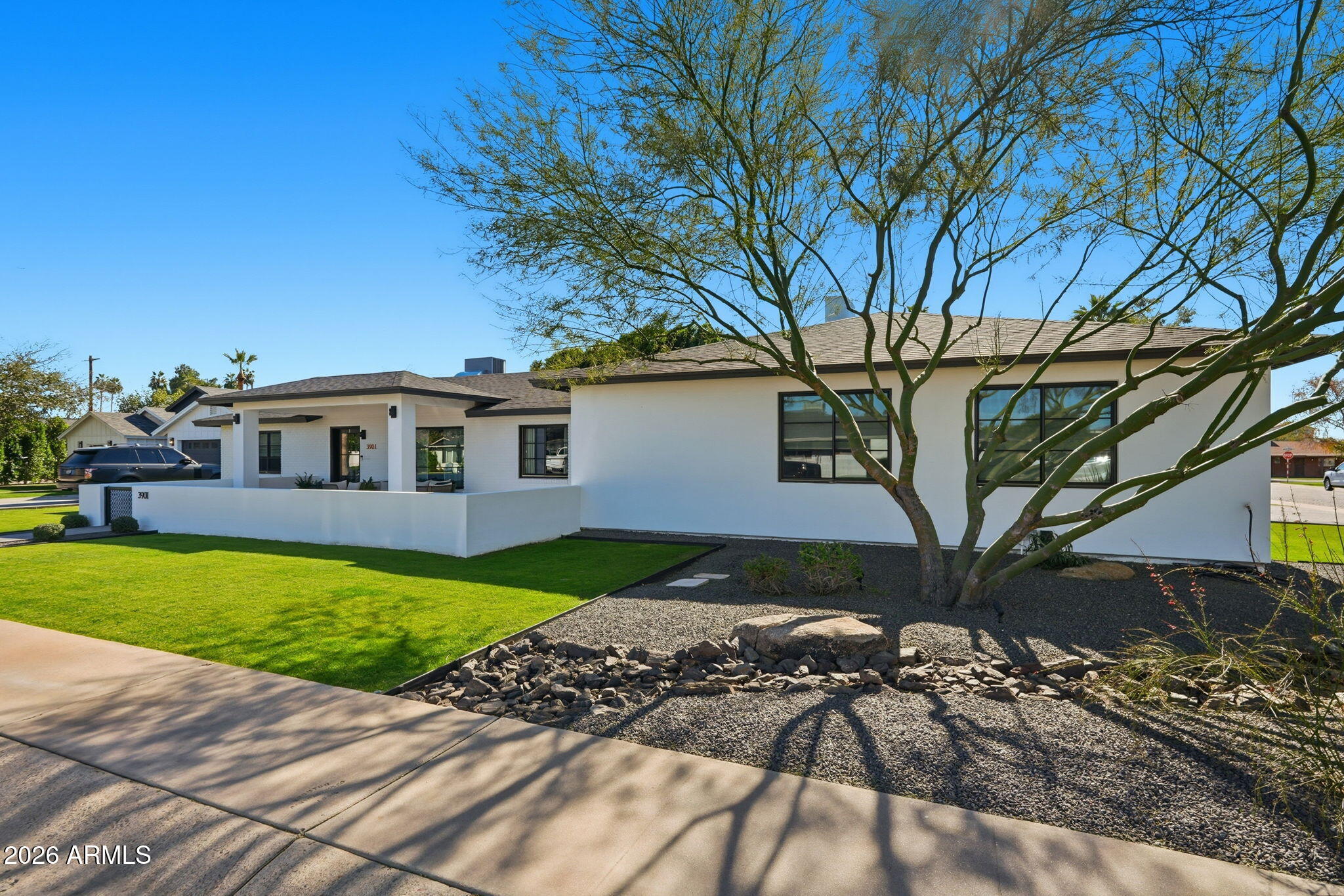 3901 East Weldon Avenue Phoenix, AZ 85018 - Photo 2 of 43 a front view of a house with garden