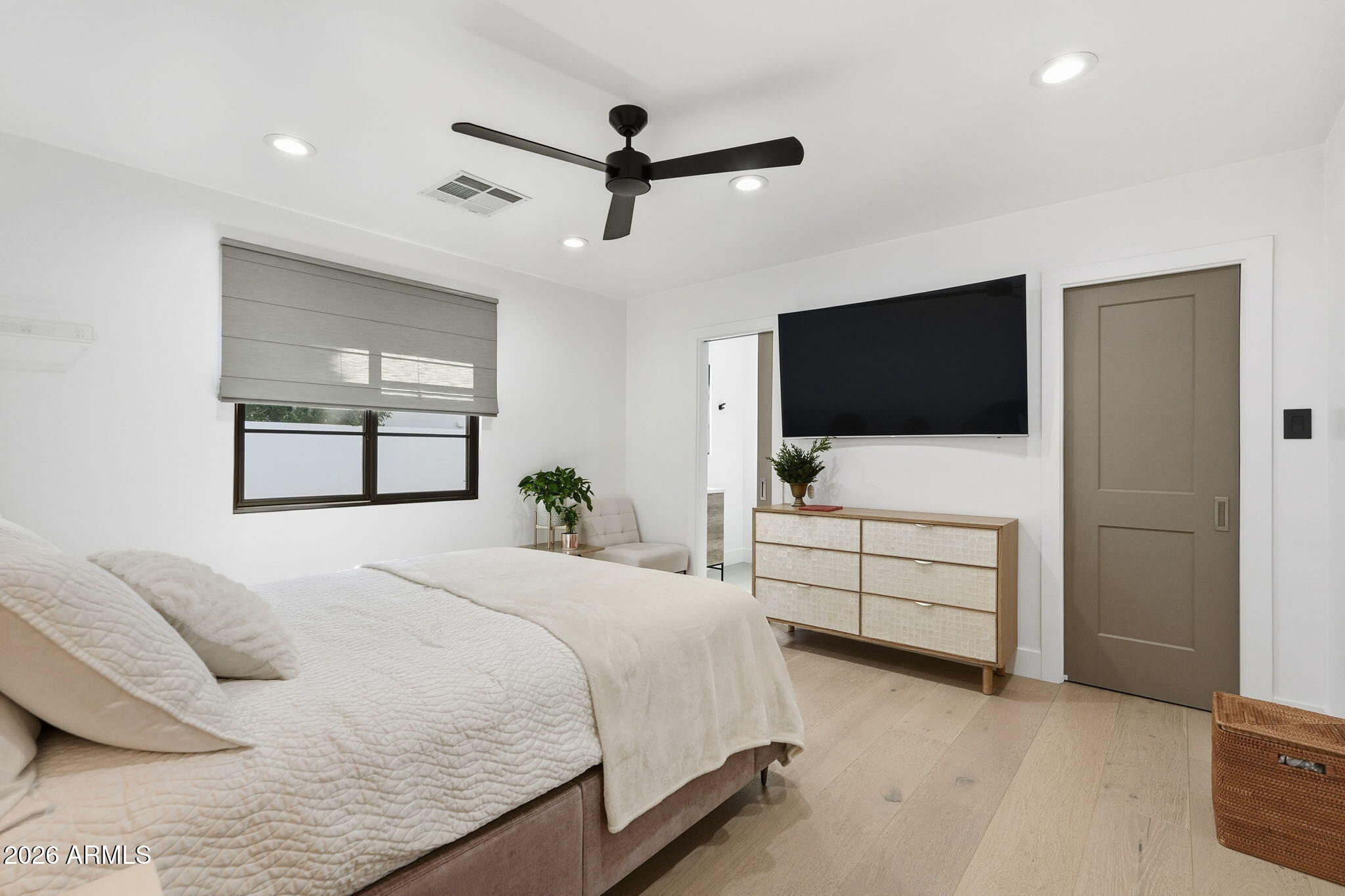 3901 East Weldon Avenue Phoenix, AZ 85018 - Photo 22 of 43 a bedroom with a bed and a flat screen tv