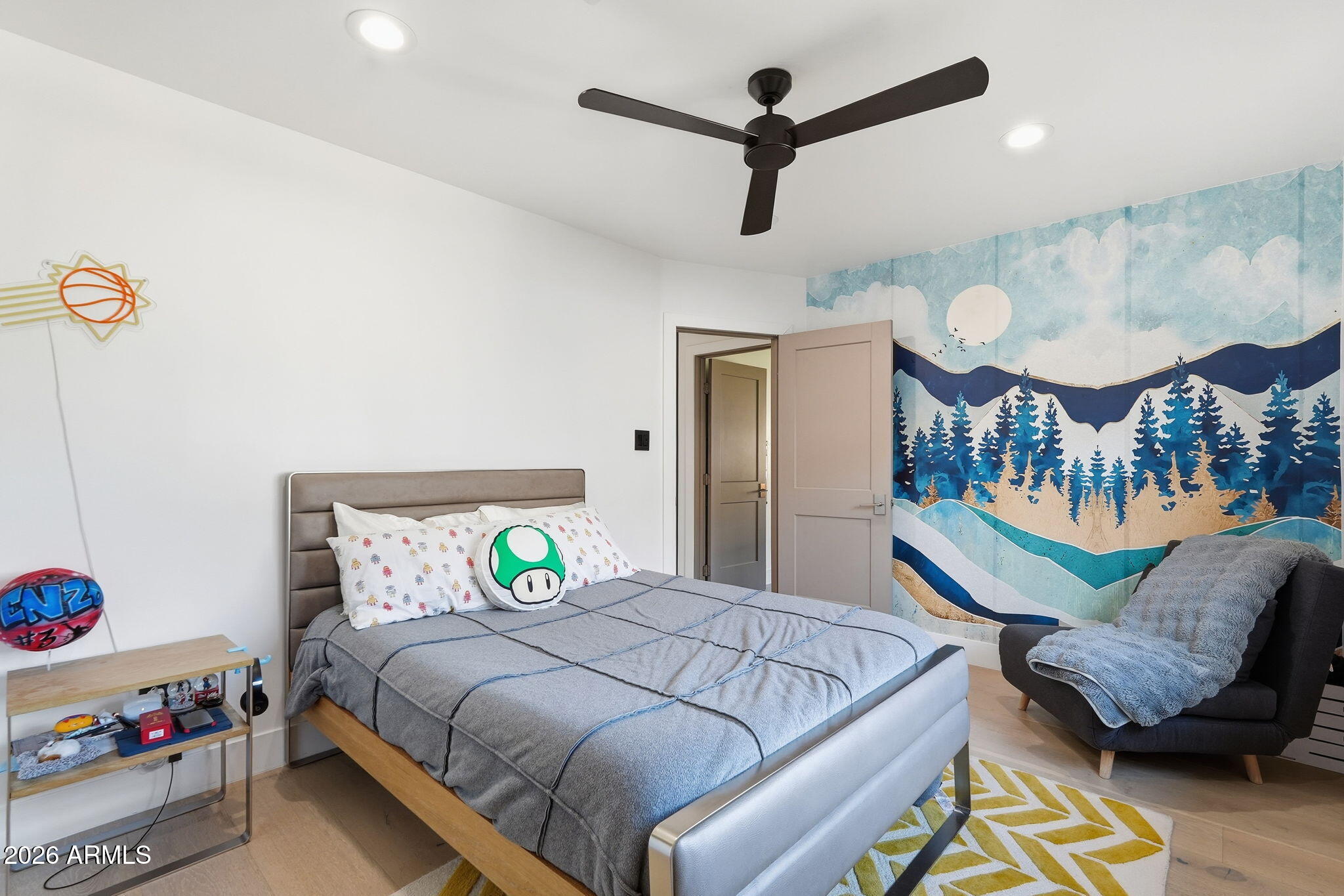 3901 East Weldon Avenue Phoenix, AZ 85018 - Photo 23 of 43 a bedroom with a bed and a chandelier