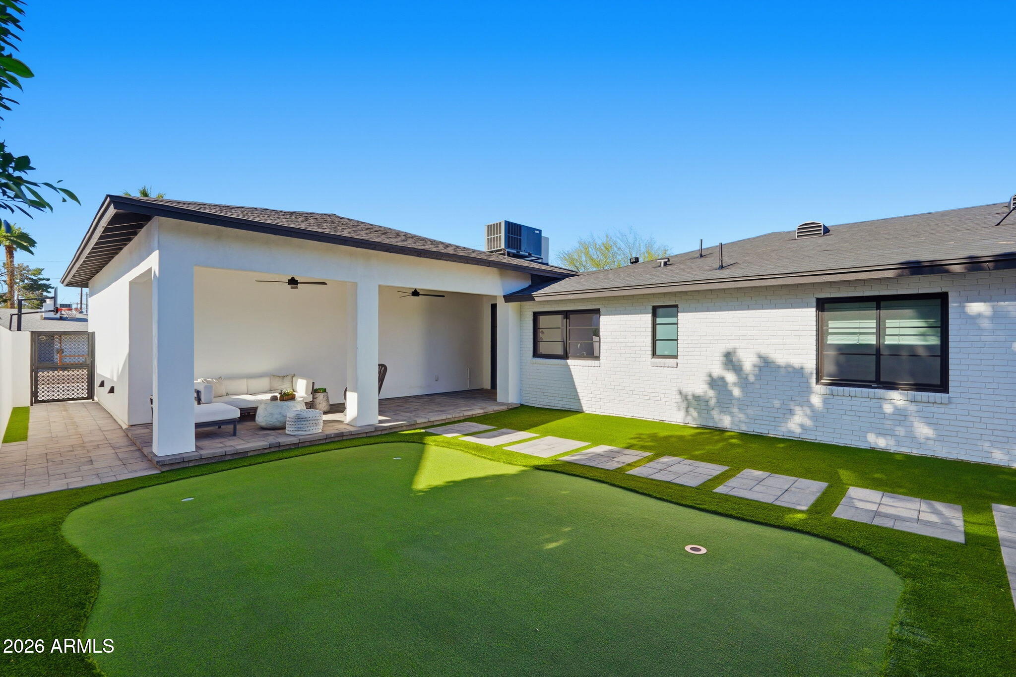 3901 East Weldon Avenue Phoenix, AZ 85018 - Photo 23 of 27 a backyard of a house with table and chairs
