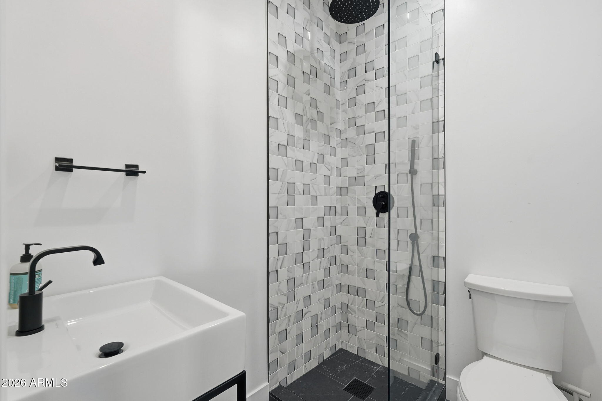 3901 East Weldon Avenue Phoenix, AZ 85018 - Photo 24 of 43 a bathroom with a sink a toilet and shower