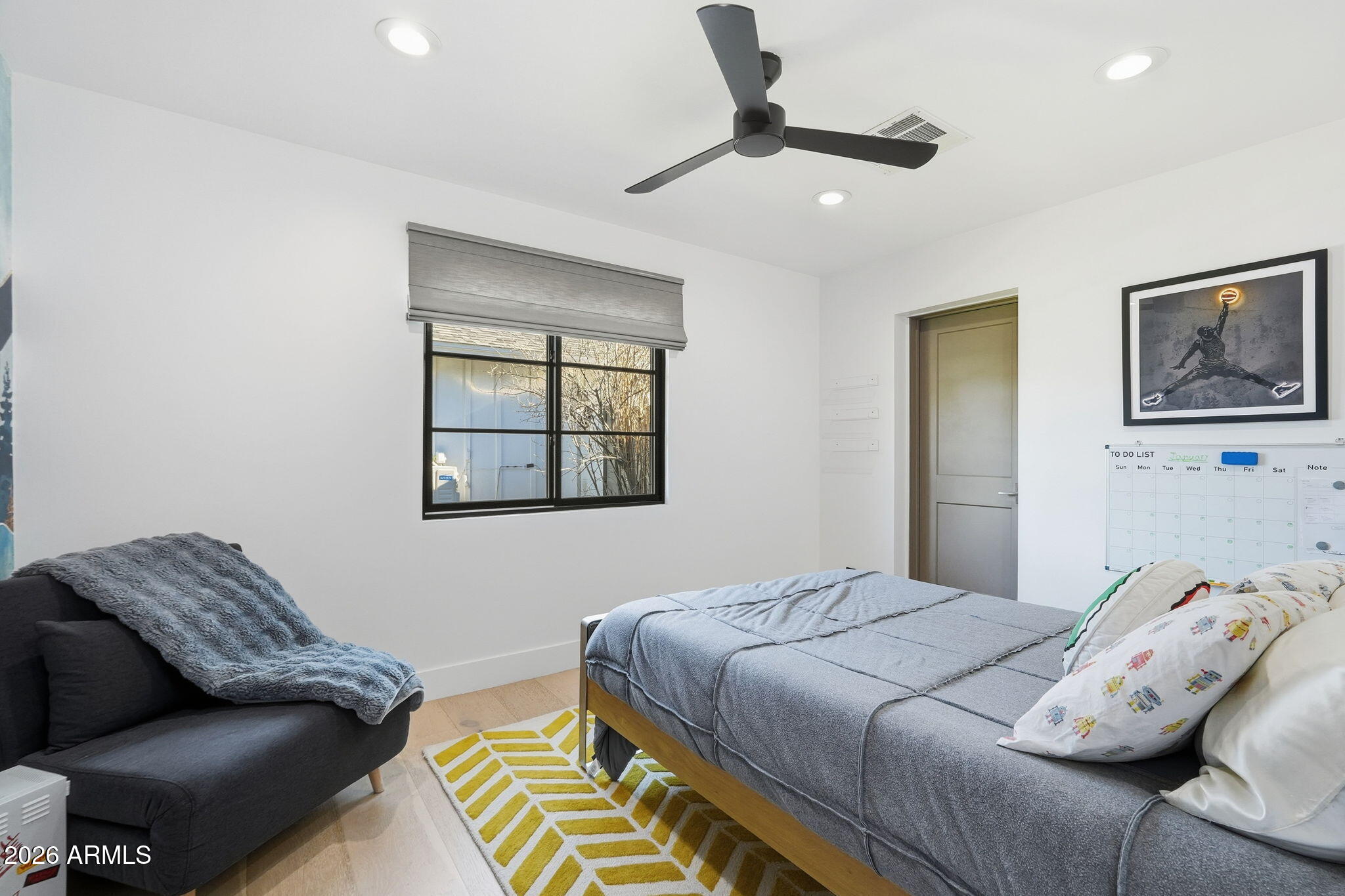 3901 East Weldon Avenue Phoenix, AZ 85018 - Photo 25 of 43 a bedroom with a bed and ceiling fan