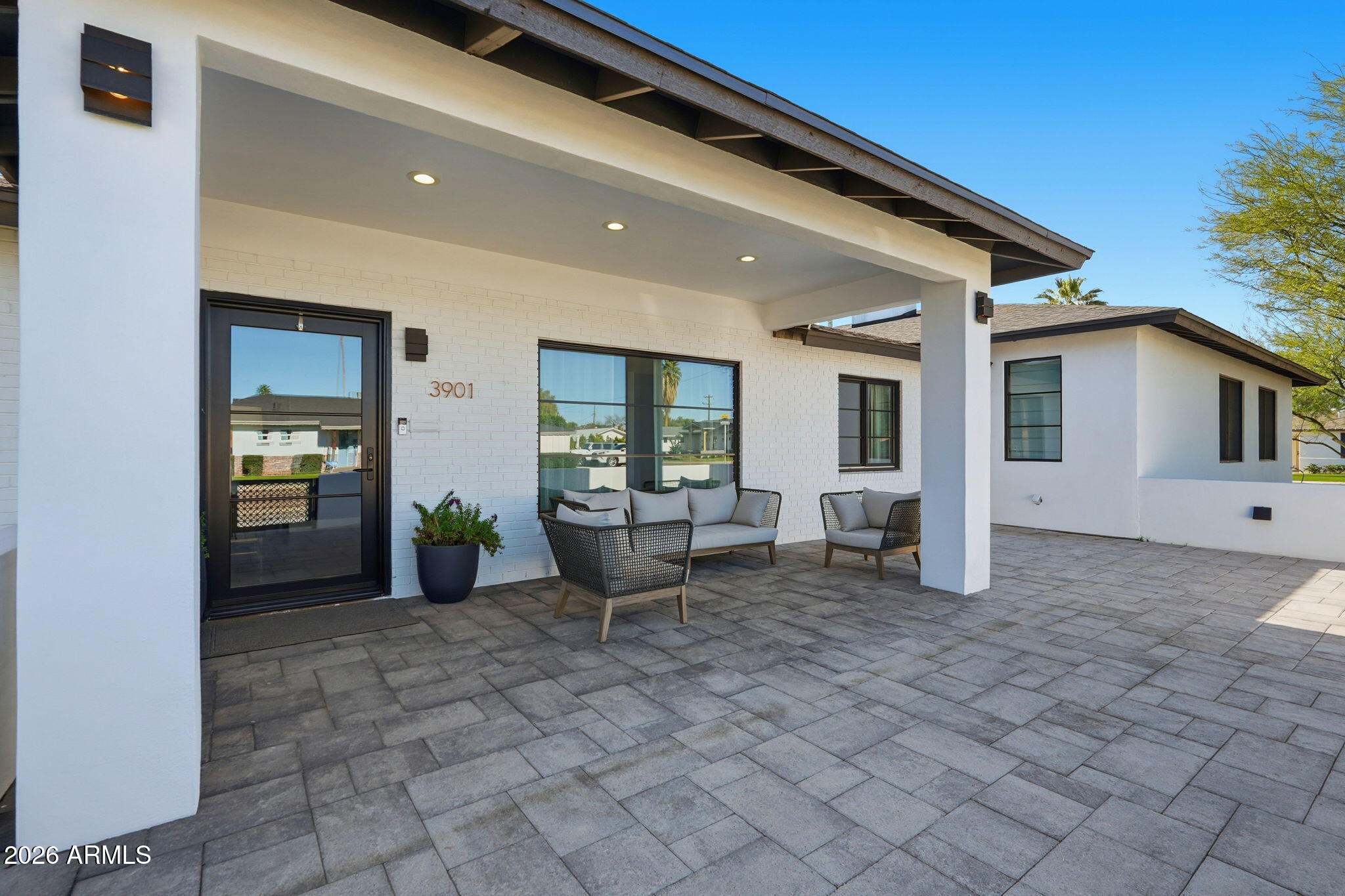 3901 East Weldon Avenue Phoenix, AZ 85018 - Photo 25 of 27 a view of a house with backyard porch and sitting area