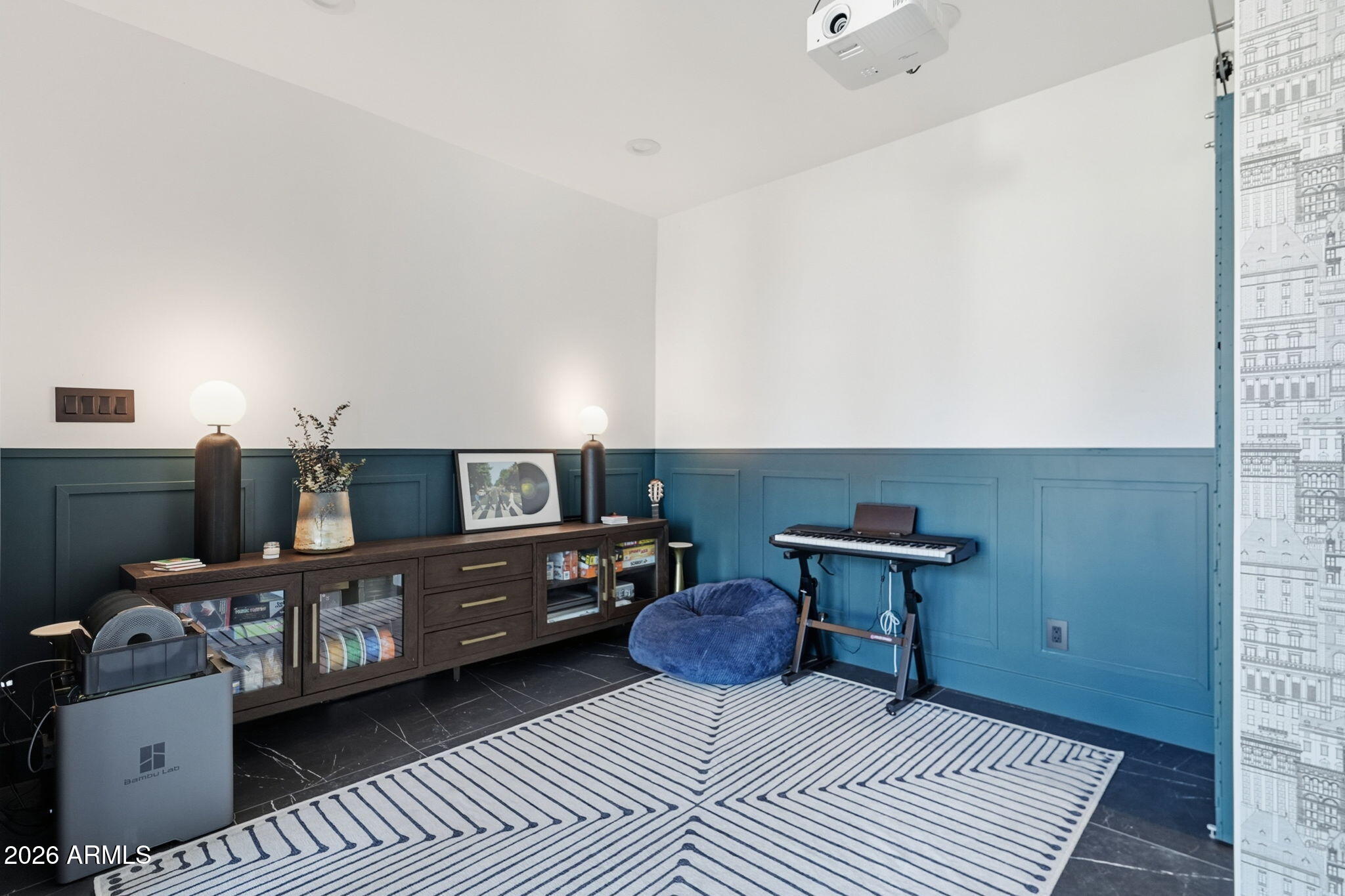 3901 East Weldon Avenue Phoenix, AZ 85018 - Photo 34 of 43 a bedroom with furniture and a book shelf