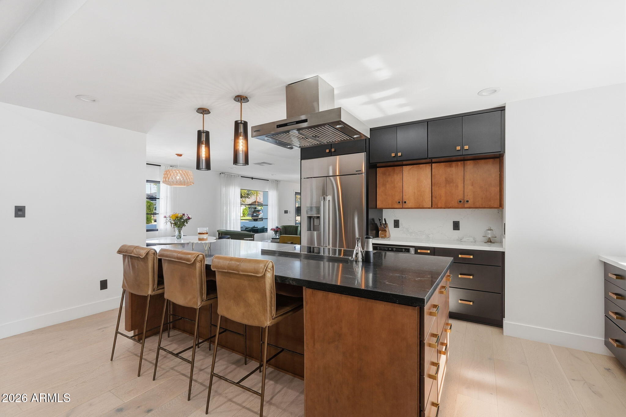 3901 East Weldon Avenue Phoenix, AZ 85018 - Photo 9 of 43 a kitchen with stainless steel appliances kitchen island granite countertop a sink and cabinets