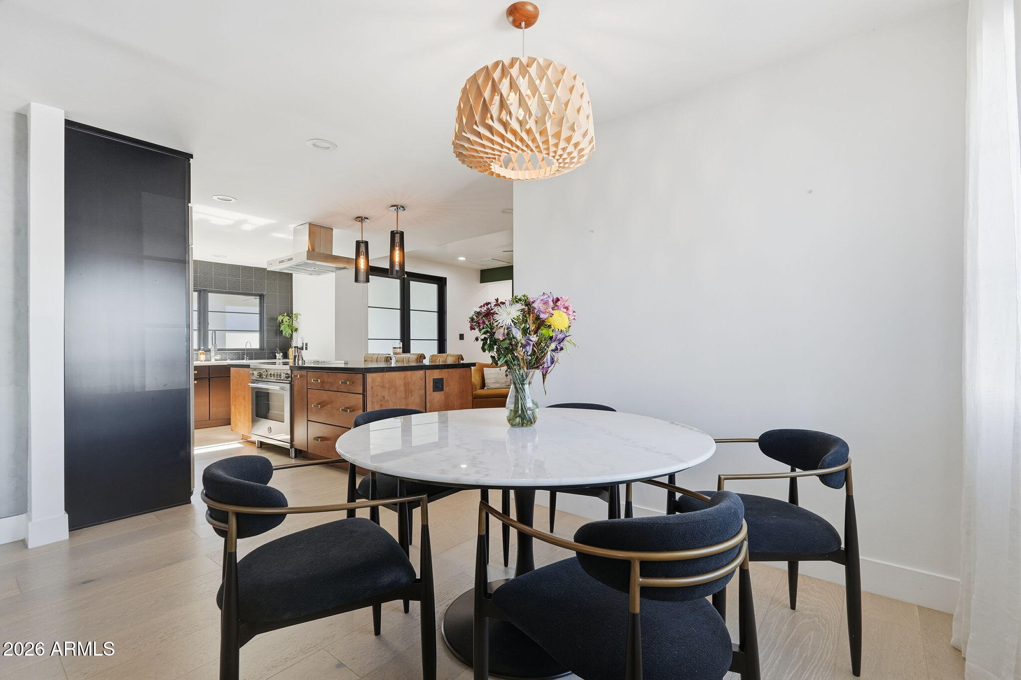 3901 East Weldon Avenue Phoenix, AZ 85018 - Photo 10 of 43 a view of a dining room with furniture and wooden floor