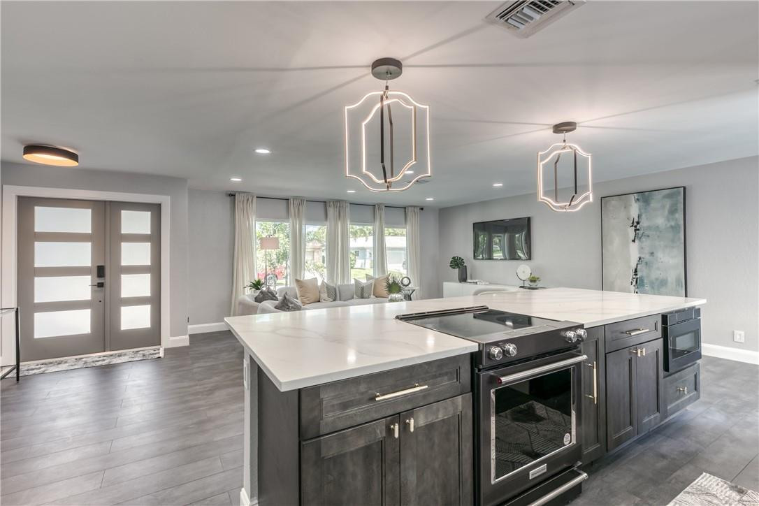 1382 Southwest 13th Drive Boca Raton, FL 33486 - Photo 10 of 65 Modern lights above the island