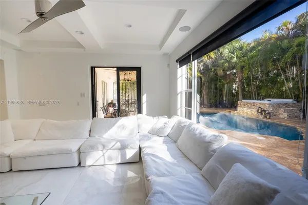 a large bedroom with a large bed and a large window