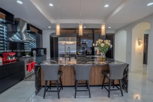 a dining room with furniture and chandelier