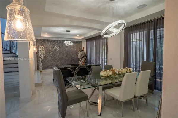 a dining room with furniture and window