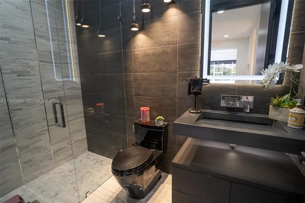 a bathroom with a toilet and a sink