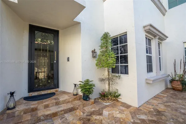 a view of potted plants in front of door