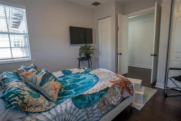 a bathroom with a double vanity sink and mirror