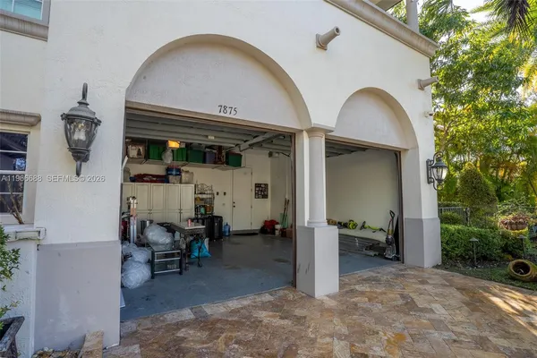 a view of living room kitchen with furniture and garden