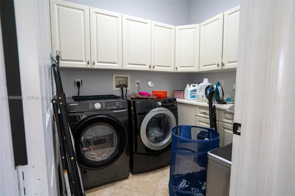 a bedroom with a bed dresser and a window
