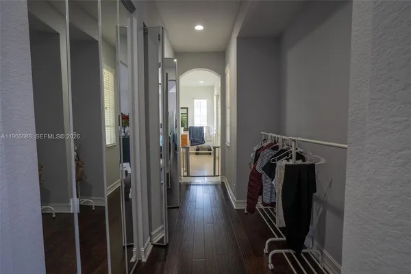 a bathroom with a tub sink and mirror