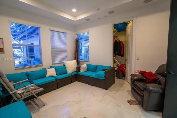 a bedroom with furniture and a couch