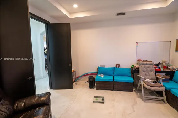 a living room with furniture and a window