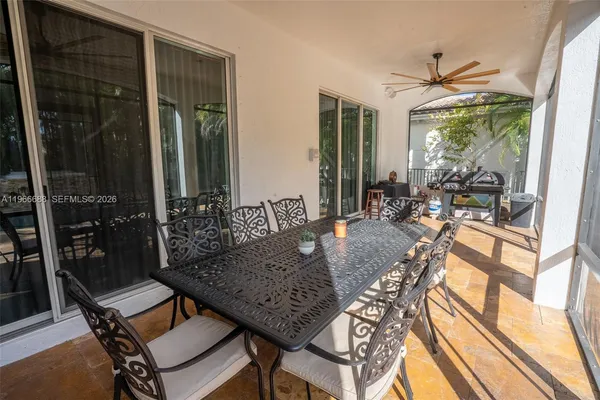 a swimming pool with outdoor seating and yard