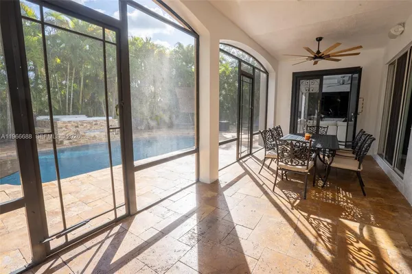 a view of patio with a table and chairs