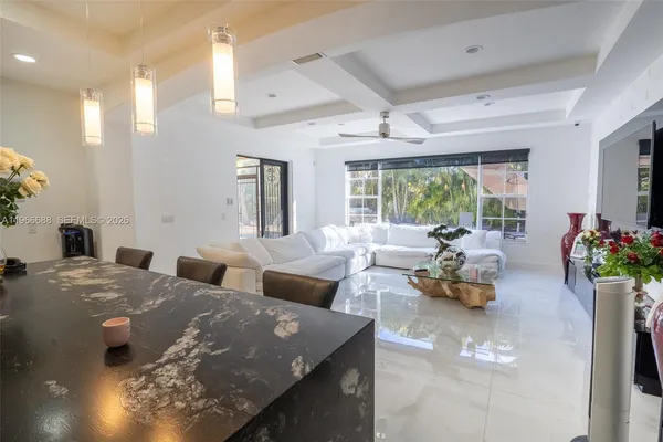 a living room with furniture and a large window