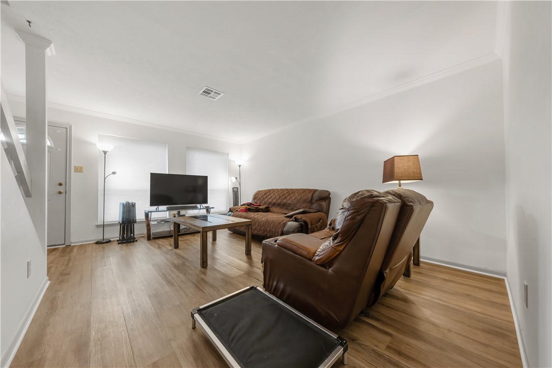 2807 Wildflower Drive, Unit 13 Bryan, TX 77802 - Photo 3 of 16 a living room with furniture and a flat screen tv