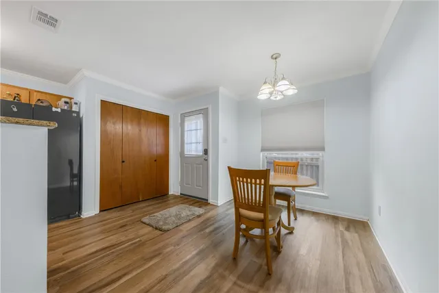 a workspace room with furniture and wooden floor