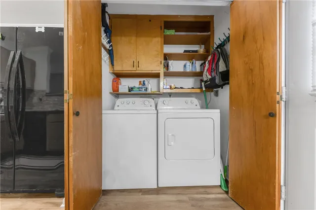 a view of storage and utility room with washer and dryer