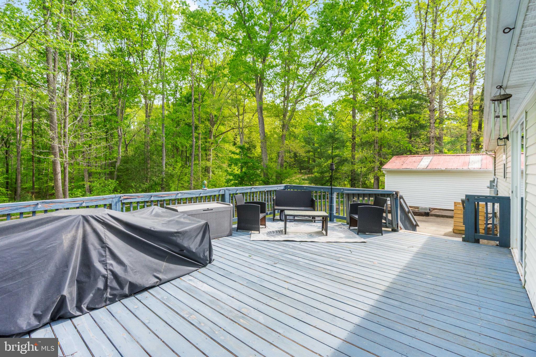2319 Sizer Road Beaverdam, VA 23015 - Photo 50 of 61 a view of house with deck and outdoor seating