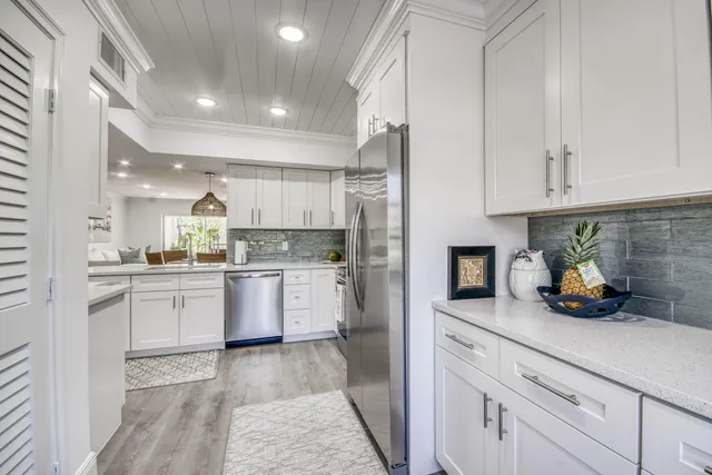 a kitchen with cabinets and window